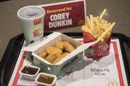 Dozens Gather To Watch McDonald's Fan Eat Chicken Nuggets - Source: Getty